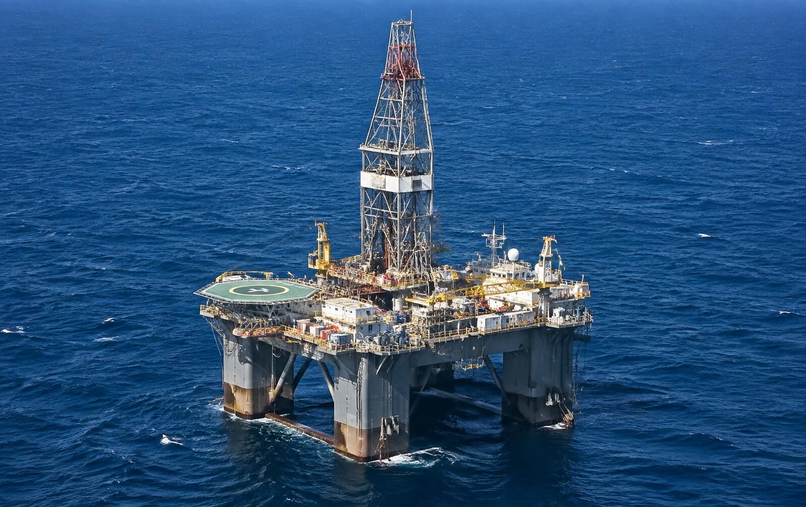 Semi-submersible offshore drilling unit in daylight on open sea
